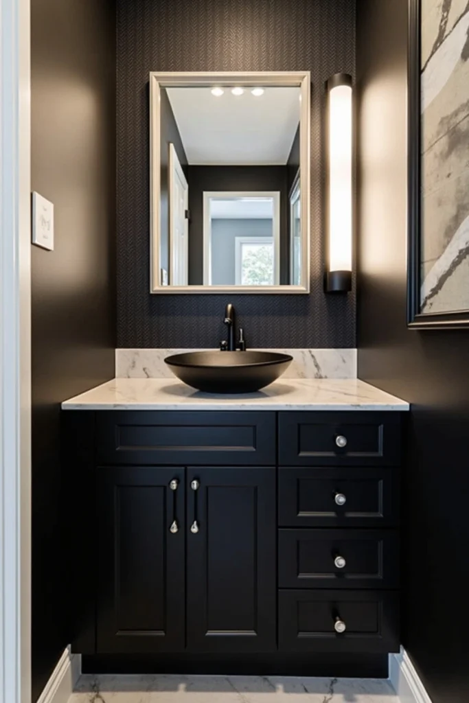 Budget bathroom makeover with black cabinets, LED mirror, removable accent wall, and matte faucets.